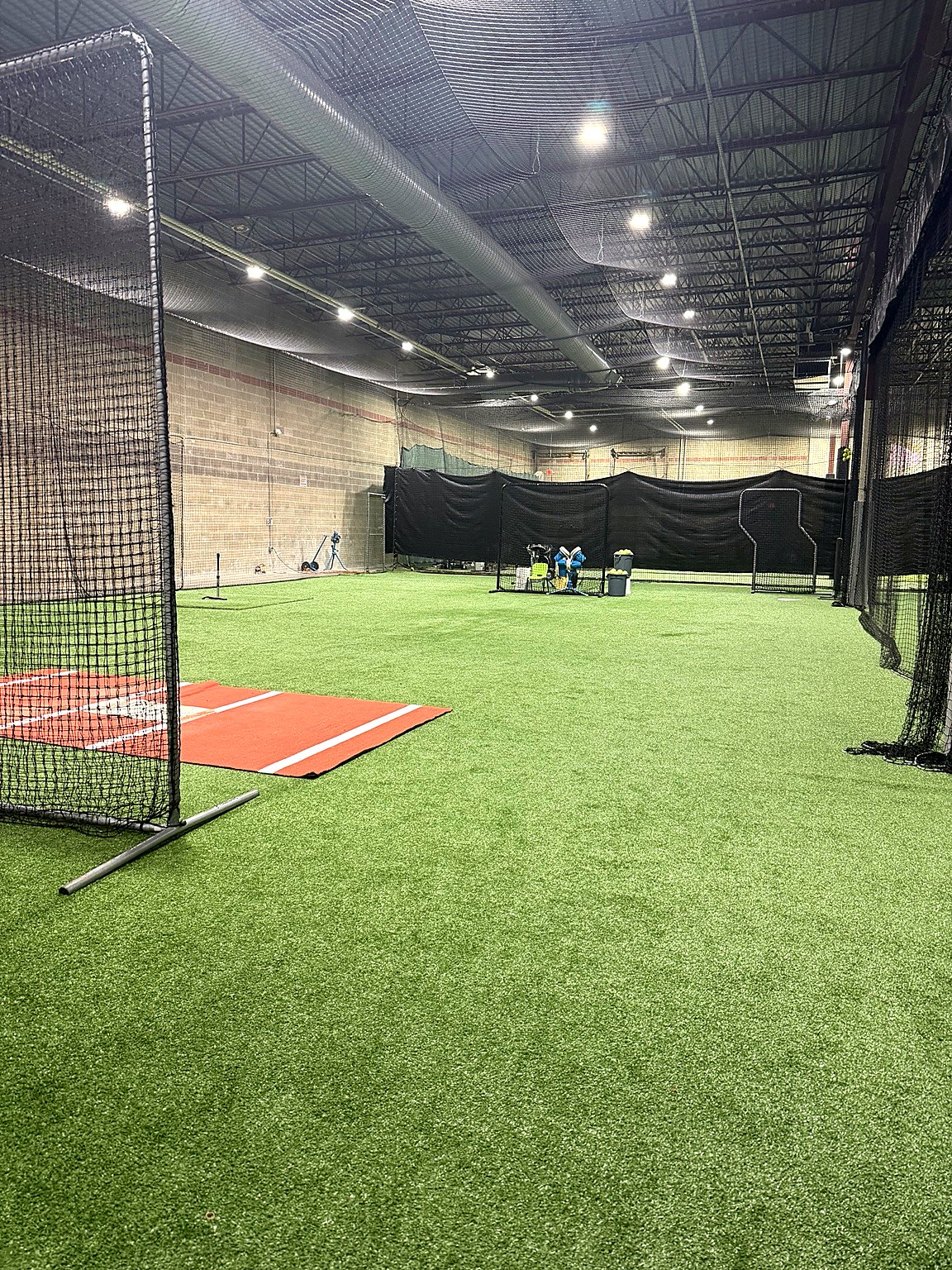 Batting cages and pitching area inside Top Tier Fieldhouse
